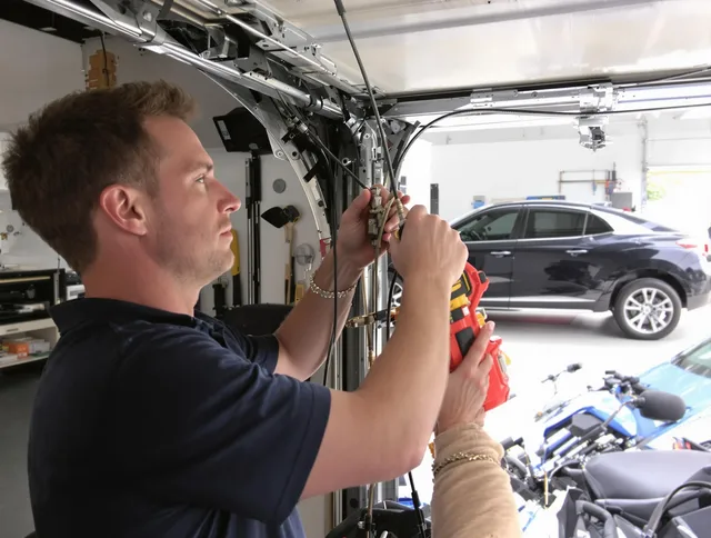 Downey Garage Door Repair safety certified technician performing cable replacement in Downey