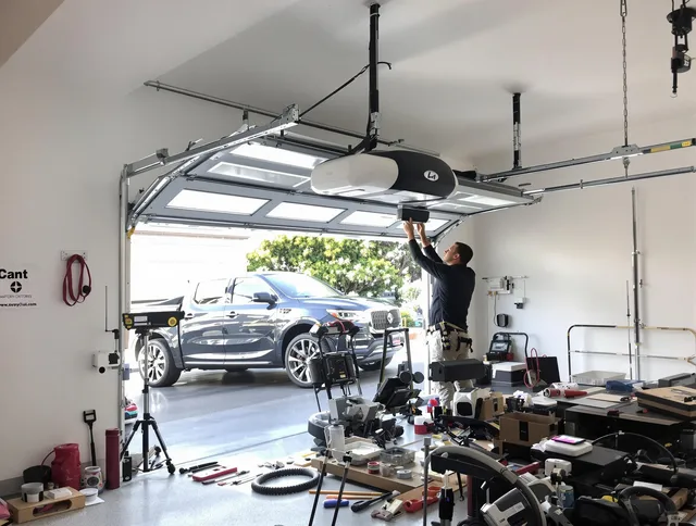 Downey Garage Door Repair specialist installing smart garage door opener system in Downey home