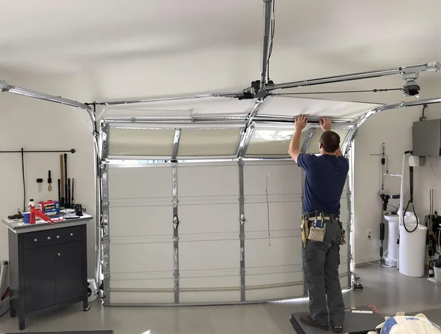 Downey Garage Door Repair specialist performing precise section replacement on Downey garage door
